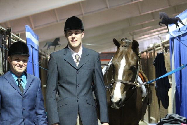 Two Men In Suits With A Horse